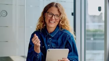 Professional smiling with a tablet