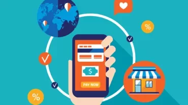 Hand holding a smartphone with a mobile payment app.