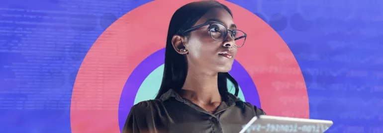 Woman with glasses holding a tablet, colorful circle and code background.