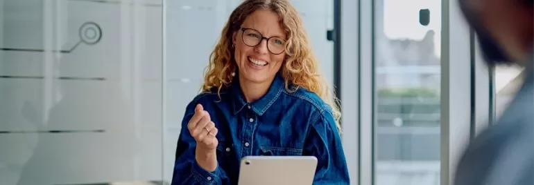 Professional smiling with a tablet