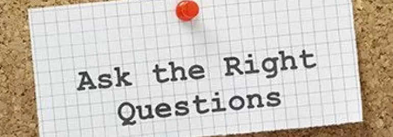 Pinned note on corkboard with 'Ask the Right Questions'