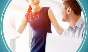 Two people communicating in an office