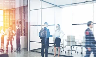 People having a business discussion in a modern office.