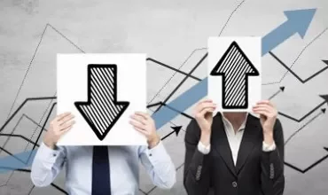 Two people holding up and down arrows. Background with graph lines.